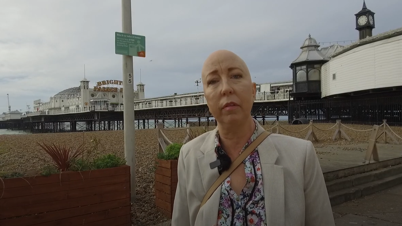 Image of Sarah Hurst, Sussex Cancer Fund ambassador, on Brighton Beach, photographer unkown