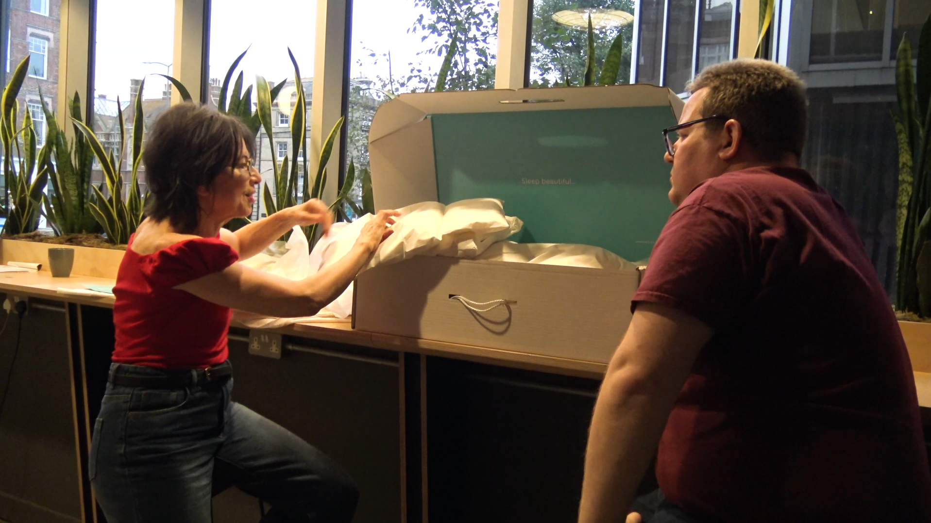 Mark Walker talking to Shula Birch who is giving a demonstration of the Waking Beauty product