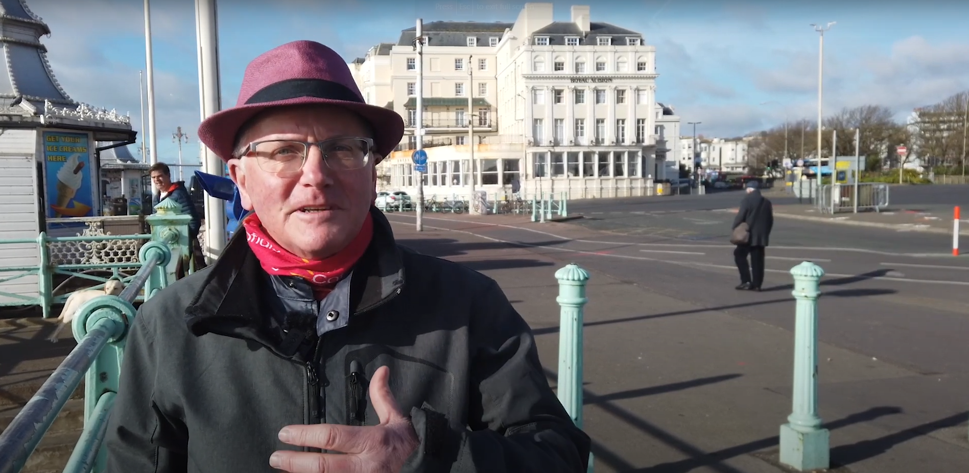 Local Musician Tim Izzard talks to the camera on brighton seafront