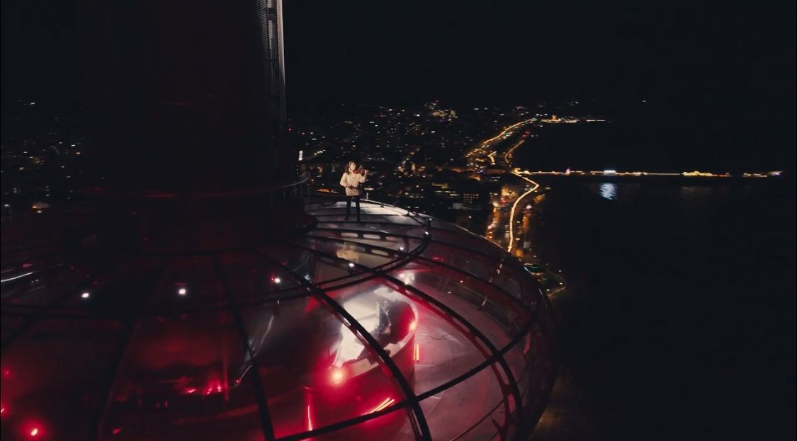 Ester Abrami performing on top of the i360 pod